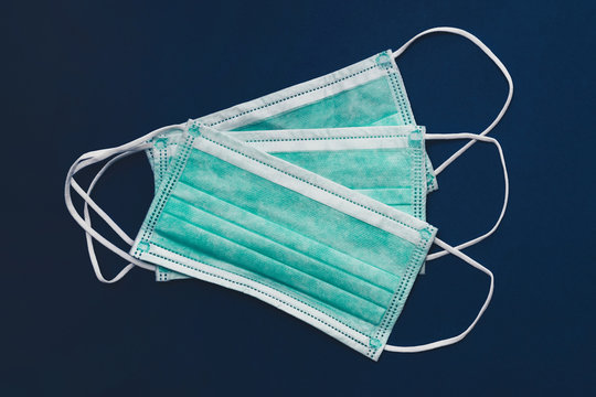 3 Medical Face Mask On Blue Paper Background