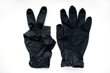 Black medical gloves on a white background