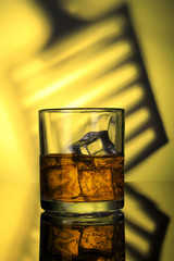 Chilled Whiskey Glass with fizzy soda and Ice Cubes