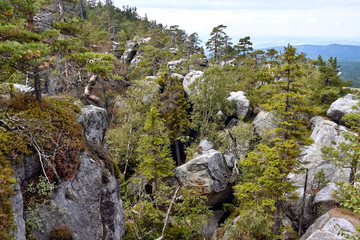 Rock formations seen from Rock Labyrinth hiking trail nearby Szczeliniec Wielki peak in Table Mountains, Poland - obrazy, fototapety, plakaty