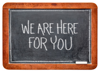 we are here for you blackboard sign with chalk