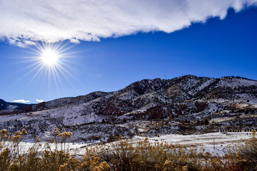 Fototapeta na wymiar Snow-covered Rockies in the sun from Dinosaur Ridge, Colorado, USA