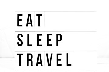 Inspirational Eat Sleep Travel Quote on Vintage Retro Board