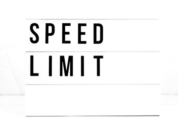 Modern Speed Limit sign on vintage retro board. Watch your speed