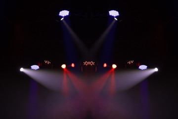 scene, stage light with colored spotlights and smoke