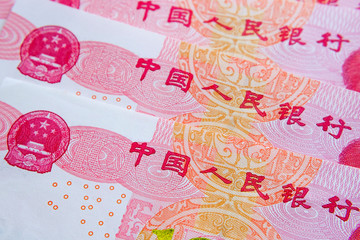 Part of Chinese yuan renminbi banknotes with words in Chinese which translate as 