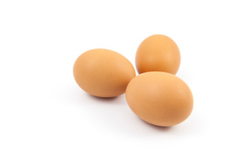 Brown eggs on white background