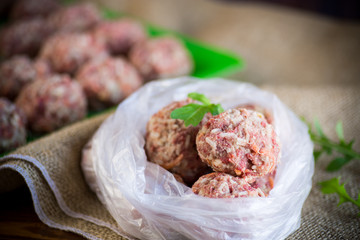 frozen raw meatballs from beef and pork with carrots and rice