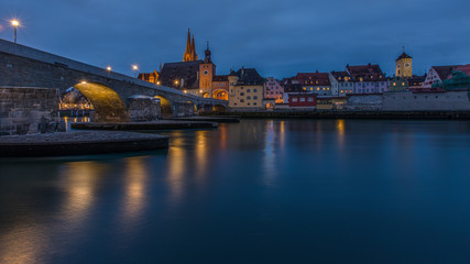 Fototapeta na wymiar The City of Regensburg in Germany in blue hour. A World Heritage Site