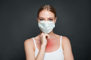Illness infected woman on dark black background portrait. Flu epidemic concept