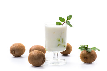 Homemade sweet yogurt with slices of ripe green kiwi in a glass