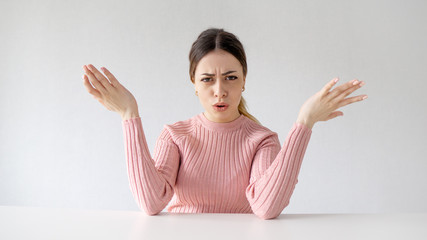 Who are you?
portrait of angry girl with ponytail hair. crazy girl spread her arms