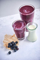 Two glasses of blueberry smoothie with milk © 4Media Creations
