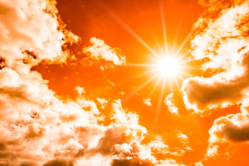 Concept for climate change or global warming, orange sky with with clouds and bright sun