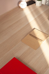 notebook lies on a wooden table
