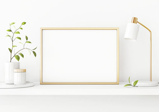 Interior poster mockup with horizontal gold metal frame on the shelf with green tree branch in vase and desk lamp on empty white wall background. A4, A3 size format. 3D rendering, illustration.