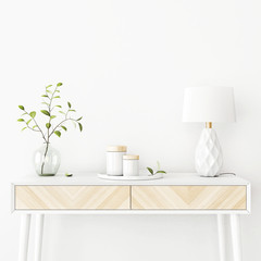 Interior wall mockup with green tree branch in vase, ceramic decore and  lamp standing on the console table on empty white background with free space on top. 3D rendering, illustration.