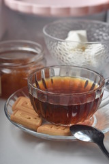 tea with sugar and jam, a beautiful cup and teapot