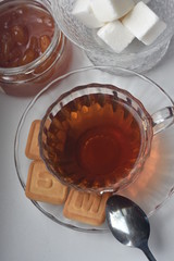 tea with sugar and jam, a beautiful cup and teapot