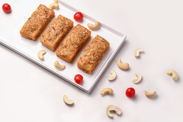 cake in white tray with flavor of cashew nut