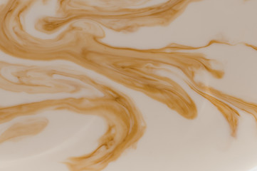 Brown stains in beige liquid 