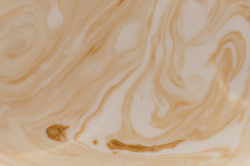 Brown stains in beige liquid 