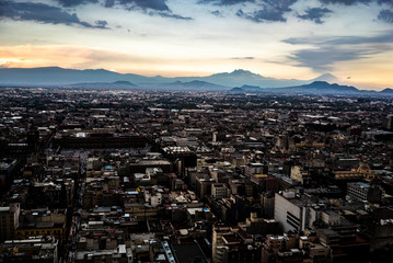 Mexico city just before sunrise. Two volcanos painting an amazing background