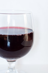 Glass of red wine isolated on white background