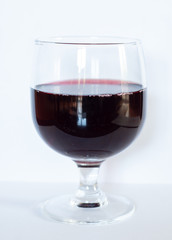 Glass of red wine isolated on white background