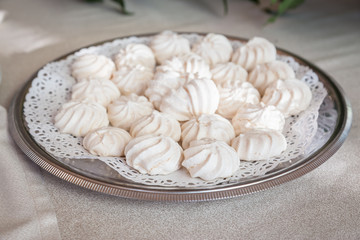 Fototapeta na wymiar white meringues on platter