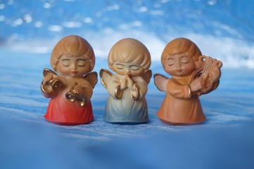 Guardian angels -  wooden angels on a blue background