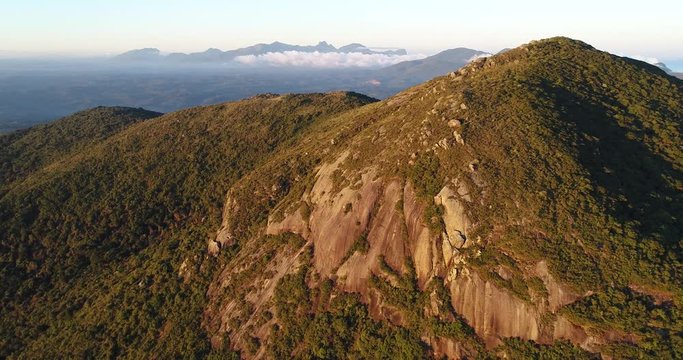 Drone shot of a mountain with the sunset light