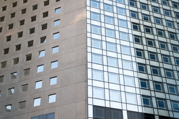 Fototapeta premium Public housing background. Urban architecture. Futurity. Multistory house construction. Frame house building. House building technology. Steel and glass structure. Constructional engineering