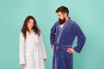 Being sad is a choice. Couple in love look sad. Sad woman and man wear bathrobes blue background. Family conflict. Depression and stress. Bedtime or morning routine. Health care. Unhappy and sad