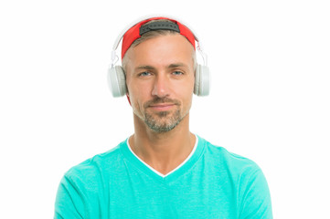 Guy in cap listen music stereo headphones. Good mood. Modern wireless headphones. Perfect sound concept. Electronic dance music and house tracks. Instrumental music. Man headphones white background