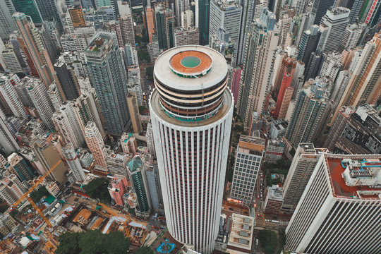 Aerial view of an iconic circular highriser with other apartments in Hong Kong.