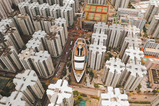 Aerial view of a boat shopping mall with symmetrical apartment blocks  in WanChai, Hong Kong.
