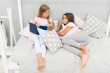 Obraz na płótnie Canvas Read to me. Little girl read story to sister. Small kids read before bed. Literature and library. Children development. Developing imagination through reading. Just want nice bedtime read