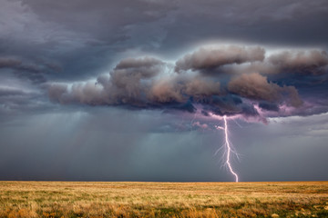 Space for text in dark cloudy sky after lightning and thunder