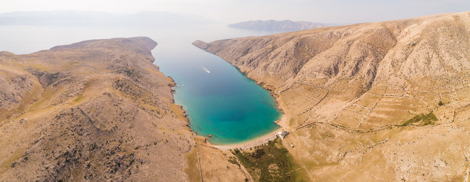 Aerial view of the Vela Luka beach on the shore of the bay in Baska, Krk island, Croatia.