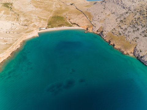 Aerial view of Vela luka beach in sunny day in Baska, Krk island, Croatia.