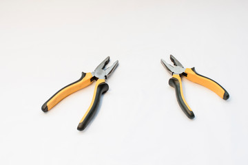 A black and yellow hand pliers copy spase on white
