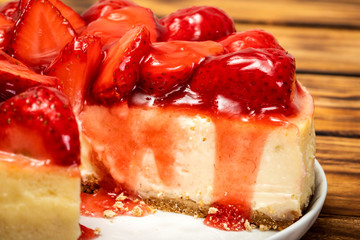 Cheese pie with whole strawberries.