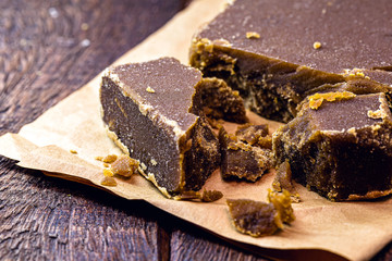 Sweet made from sugar cane, on a rustic wooden table, delicacy from Latin America, homemade desserts,