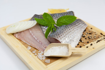 mullet fresh fish on a cutting board