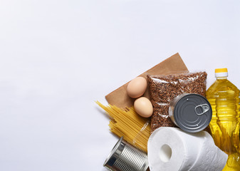 Food donations: butter, eggs, groceries, toilet paper. Food delivery. Groceries on a white background.