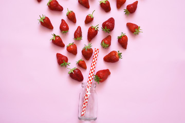 Food background: strawberry smoothie. Ingredients for making smoothie, jar and straws.