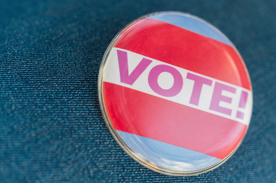 Close up of Vote button on jeans fabric
