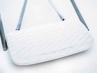White wireless internet router on a white background.
Close-up of a wi-fi router. wi-fi router with...