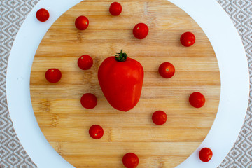 Naklejka na ściany i meble tomatoes over wood table